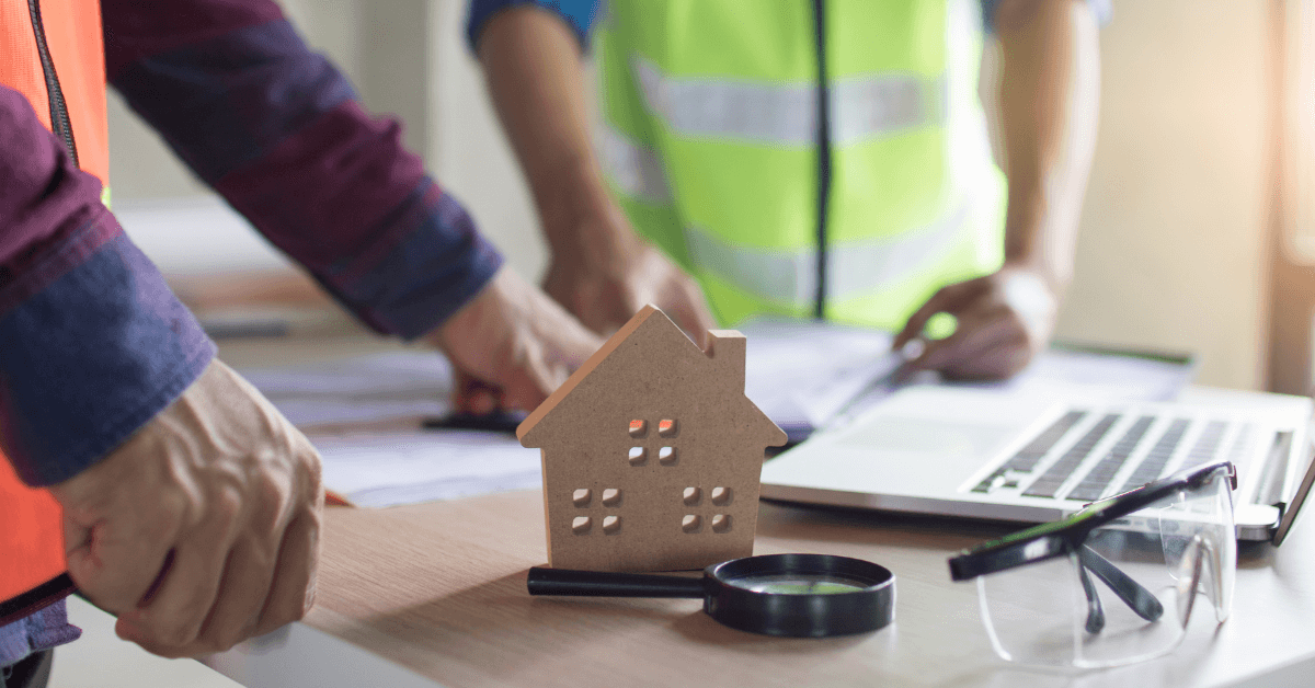 Local roofing contractors reviewing paperwork for free roof estimates