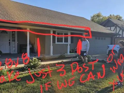 Window and door layout marked in red on a home exterior photo
