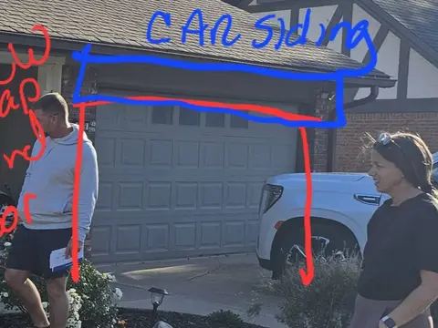 Proposed new window and door marked on a photo of a house