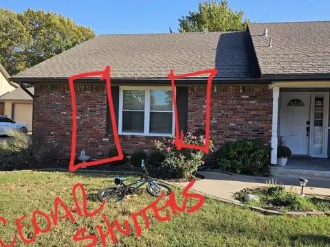Front of a brick home with window and door locations marked in red