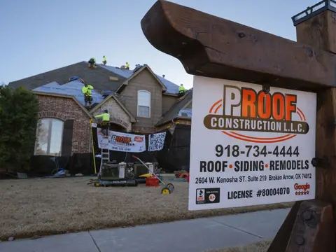 Proof Construction yard sign in front of a home while the crew works