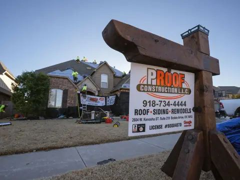 Proof Construction yard sign and crew truck at a residential job
