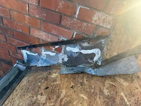 New metal flashing at a chimney