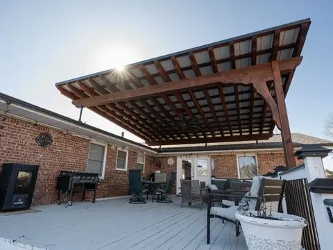 Cedar pergola over a backyard patio