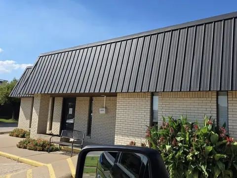 Standing-seam metal roof on a commercial building