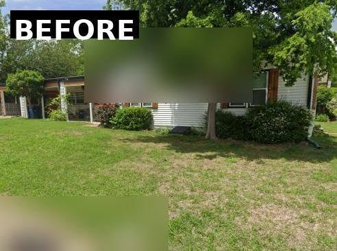 A blurred image shows a house with a lawn and trees.