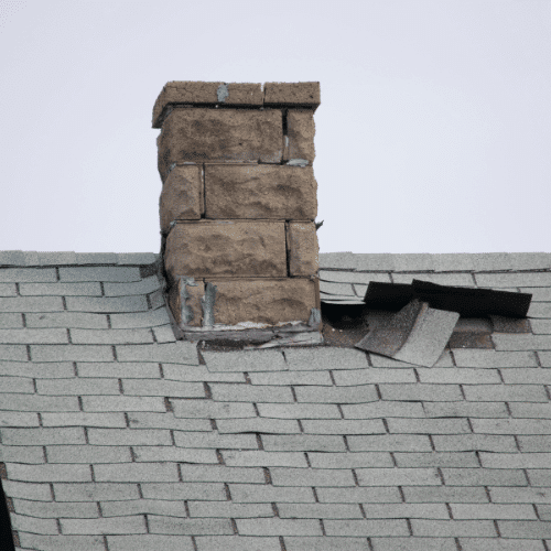 Damaged roof needing emergency shingle repairs