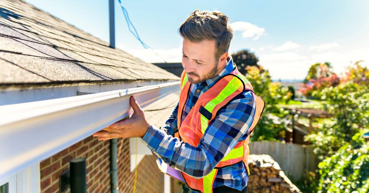 Residential roof inspection looking for signs of roof repairs or replacement