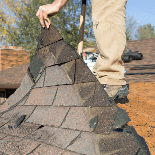 Broken Arrow roofing contractor inspecting a roof repair service