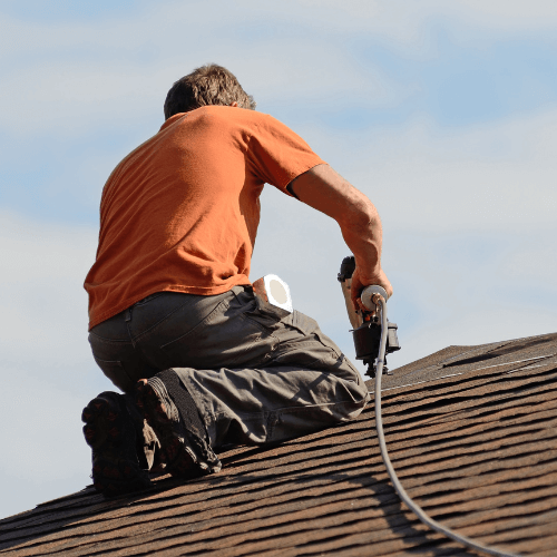 Roof contractor completing professional roof repair services